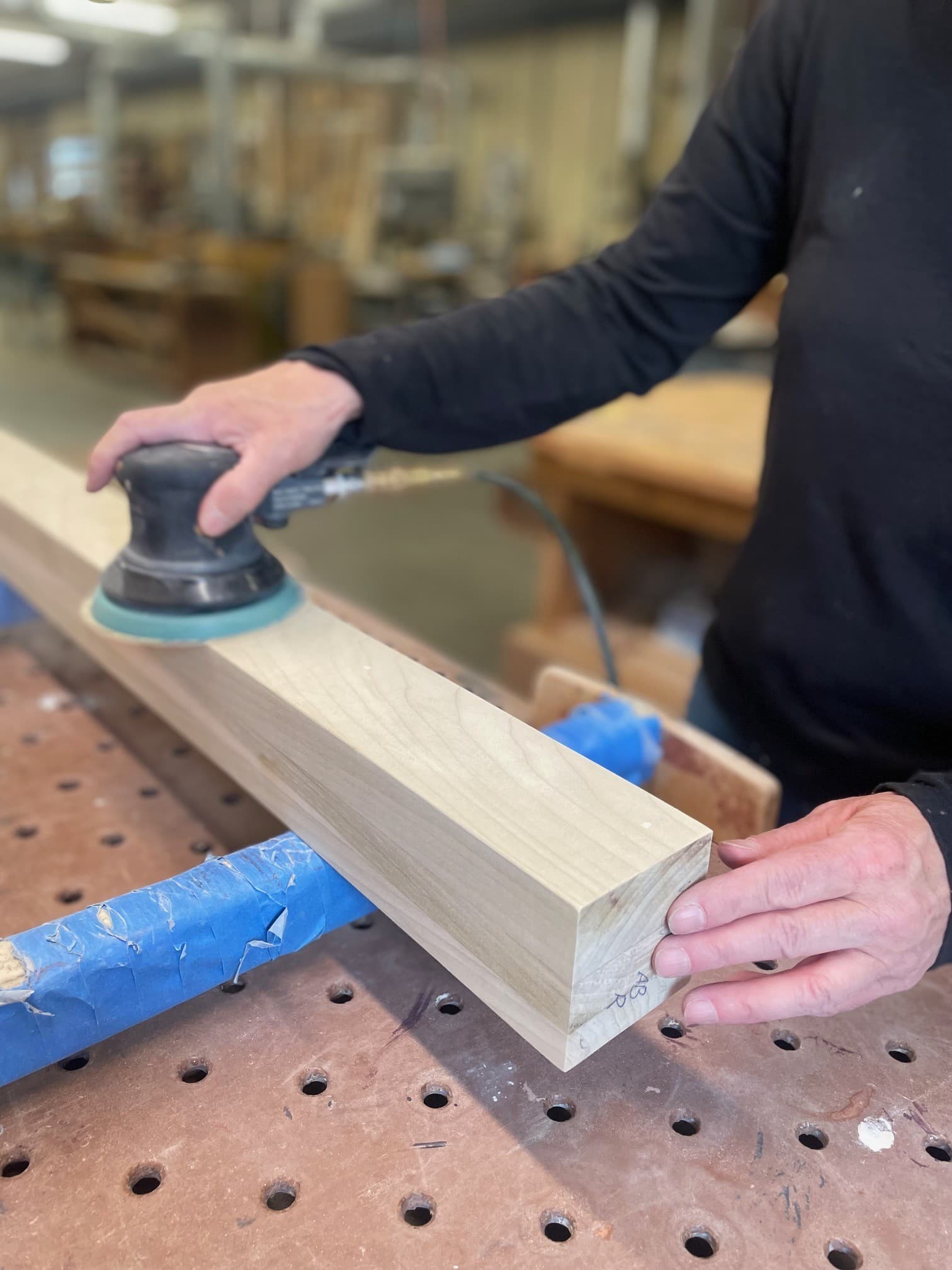 Lloyd’s Cabinet Shop founder, Lloyd, working on a cabinet project in the shop